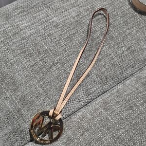 Michael KORS Emblem With Leather Strap